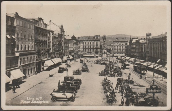 Monochrome real photographic postcard showing an animated view of the Franz Josefsplatz at Linz in Austria.
Published by JPL, possibly J. Pick, Linz, No 2100, c.1930.
Postally used, stamp with cancellation removed, and sent to Győr, Hungary.
Good condition, with some corner bumps.