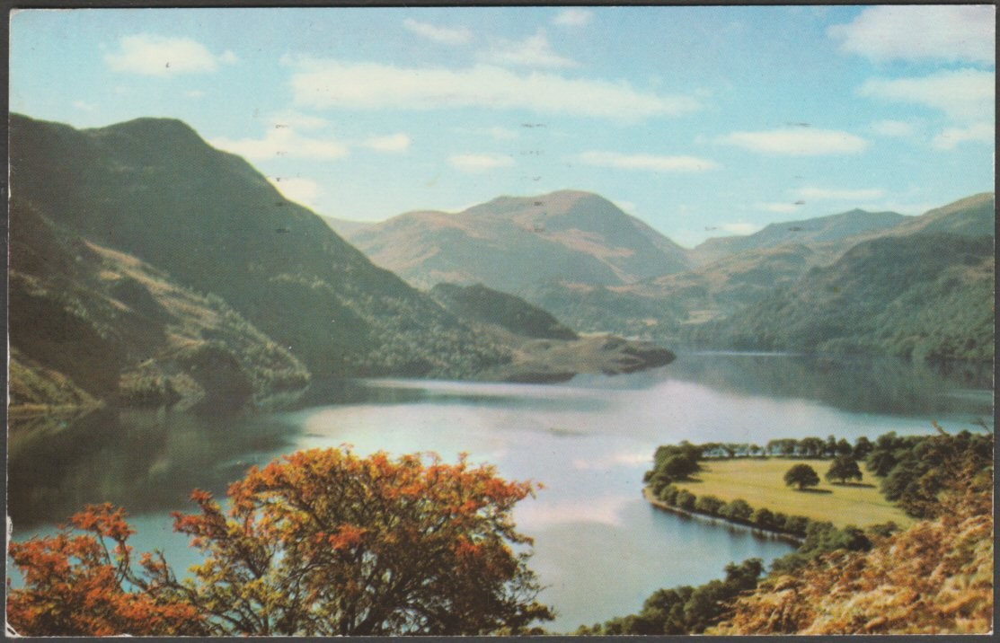 Printed colour postcard showing a view of autumn calm on Ullswater in Cumberland.
Published by Sanderson & Dixon, Ambleside, printed by Jarrold & Sons Ltd, Norwich, No KLD 154.
Postally used on 19 October 1972 with Keswick cancellation and sent to Hassocks, Sussex.
Good condition, with very slight corner bumps, but very mild bend to centre of left edge.